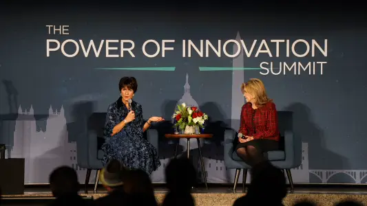 Jeanne Allen speaking on stage